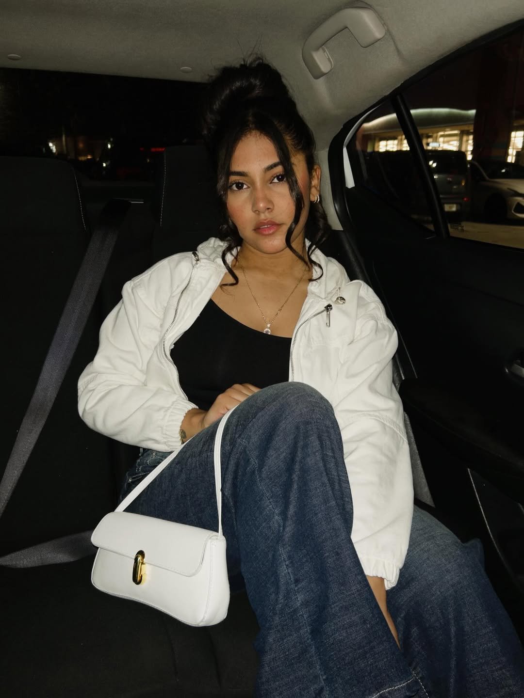 Backseat content with white bag